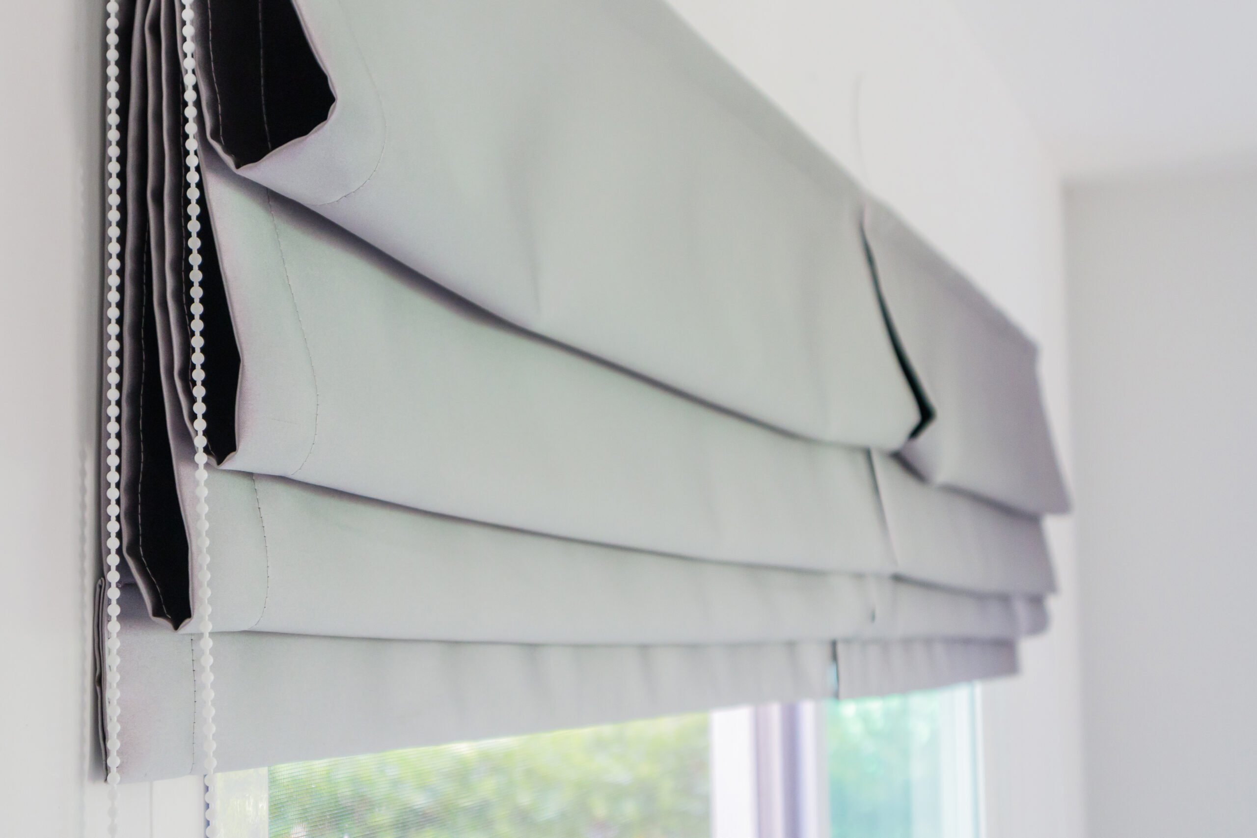 Roman blind curtain decoration in living room interior